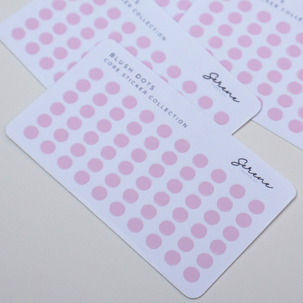 Pink dot stickers on white cards with Serene branding on a light gray background