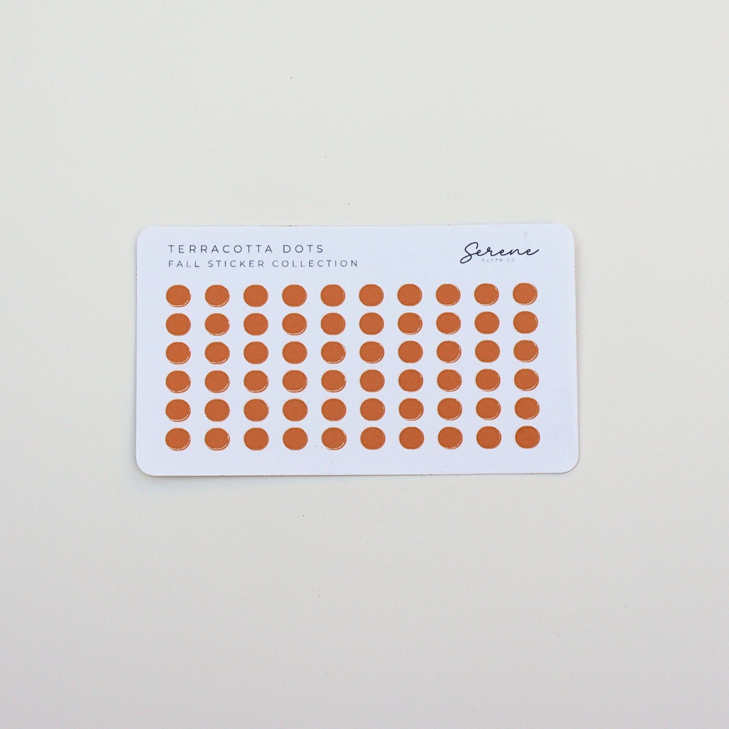 Sheet of orange stickers with a white border on a light gray background