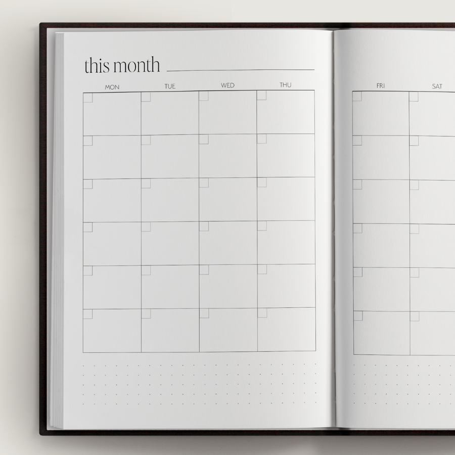 Open planner showing a monthly calendar layout with grid lines.