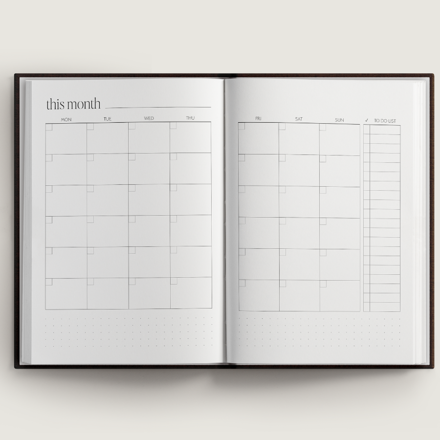 Open planner with calendar layout on a white background
