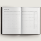 Open planner with calendar layout on a white background