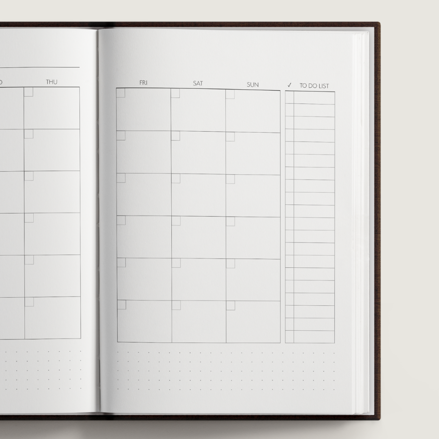 Open planner with calendar and to-do list sections on a white background