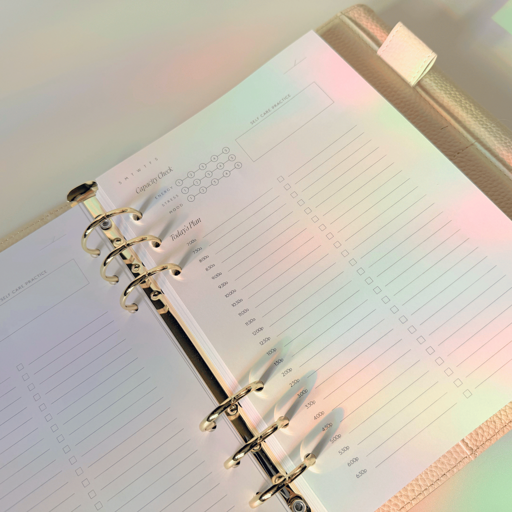Open planner with colorful light effects on a blurred background