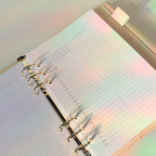 Open planner with colorful light effects on a blurred background