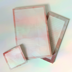 Set of lined paper sheets with a pink border on a gradient background