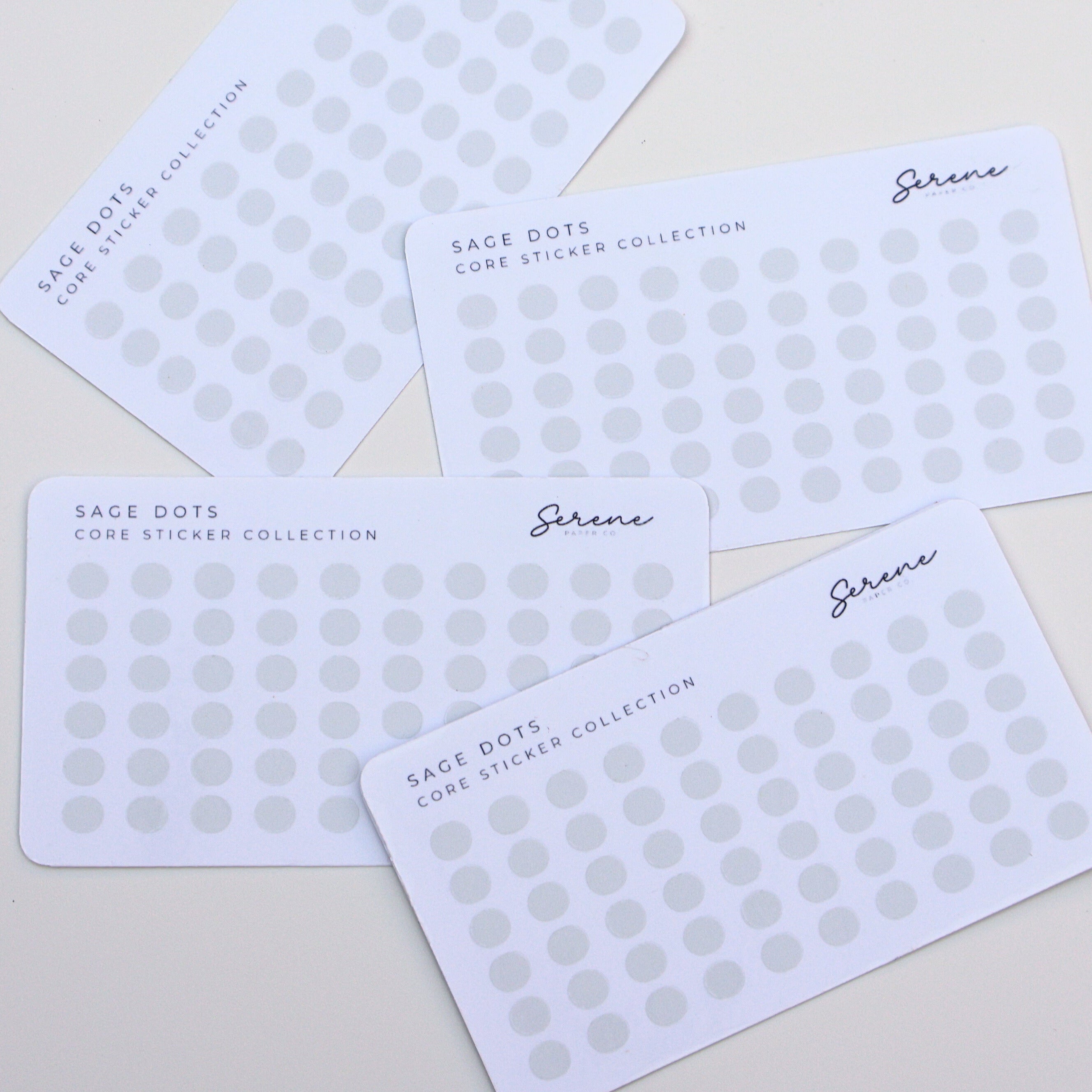 Five white cards with gray polka dots and 'Serene' branding on a light gray background
