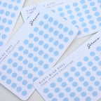 Transparent dusty blue polka dot stickers on white cards